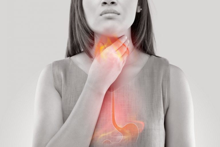 Woman,Suffering,From,Acid,Reflux,Or,Heartburn-isolated,On,White,Background