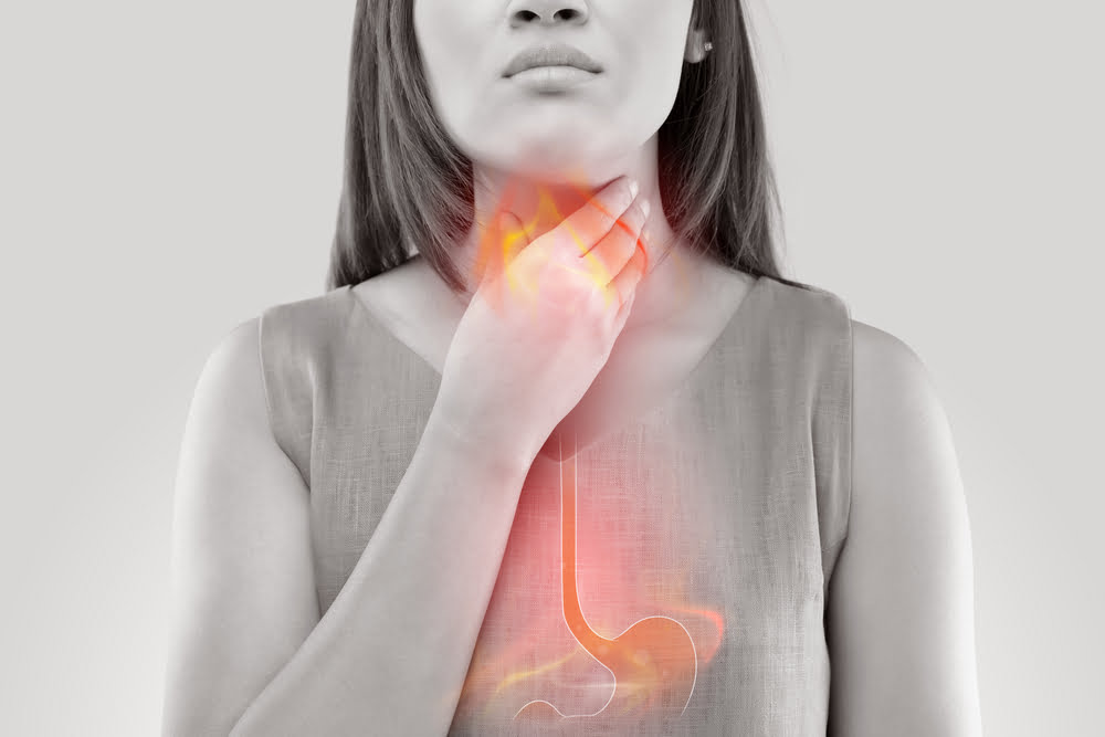 Woman,Suffering,From,Acid,Reflux,Or,Heartburn-isolated,On,White,Background